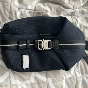 Tumi Bozeman blue Sling bag.  Unisex